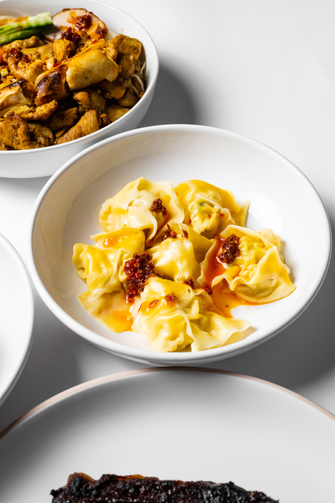 Wonton dumplings with our homemade chili oil sauce